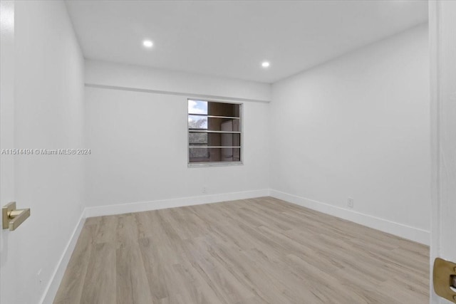 spare room with light hardwood / wood-style floors