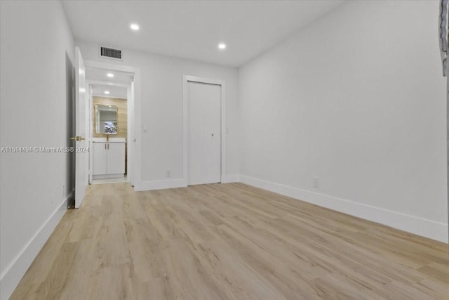 unfurnished room with light hardwood / wood-style flooring