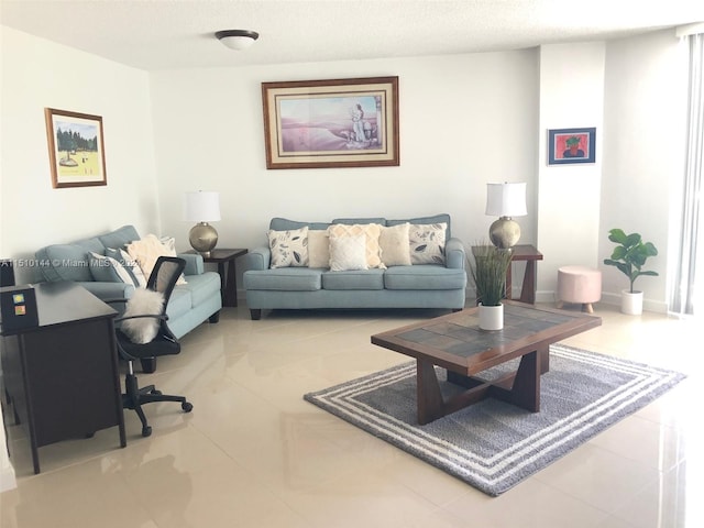 tiled living room with a textured ceiling