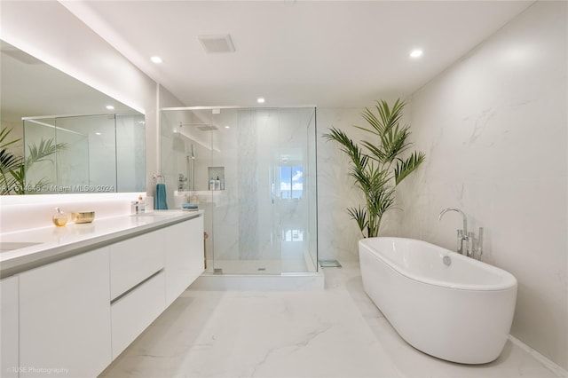 bathroom with tile flooring, tile walls, plus walk in shower, and dual bowl vanity