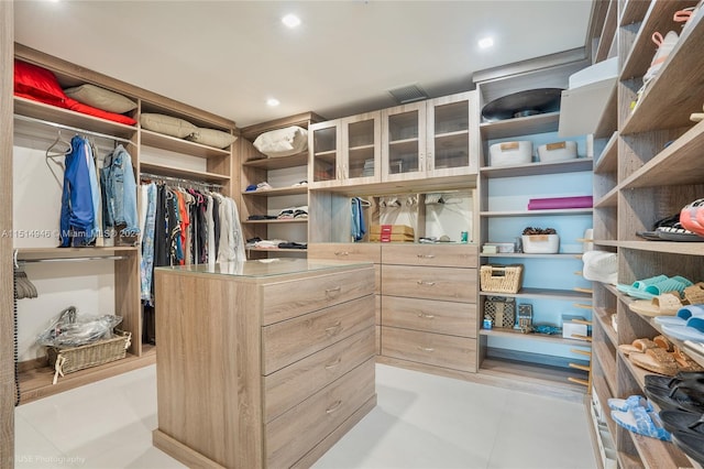 spacious closet featuring light tile floors