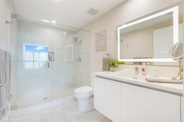 bathroom with tile floors, toilet, walk in shower, and vanity