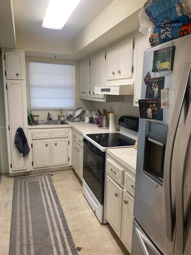 kitchen featuring stainless steel refrigerator with ice dispenser, sink, extractor fan, and electric stove