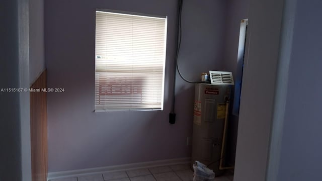 utility room featuring electric water heater