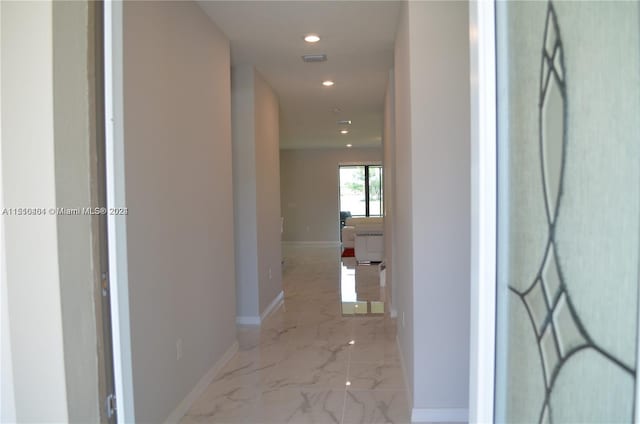 corridor featuring light tile flooring