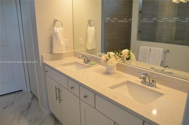 bathroom featuring tile floors, double sink, and vanity with extensive cabinet space