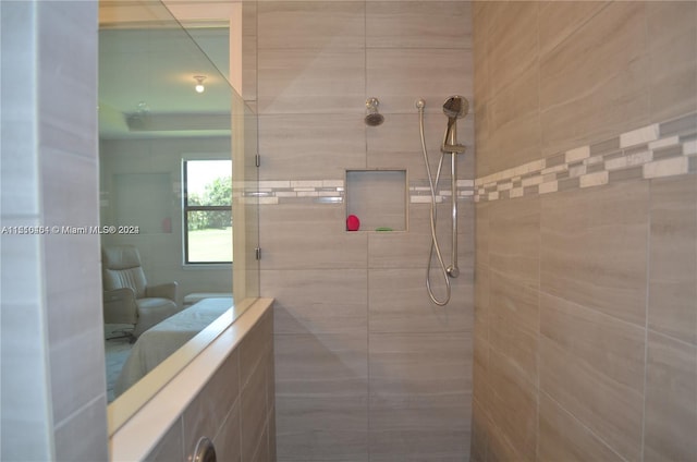 bathroom with tiled shower