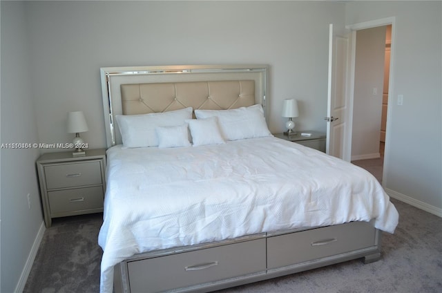 bedroom featuring dark colored carpet