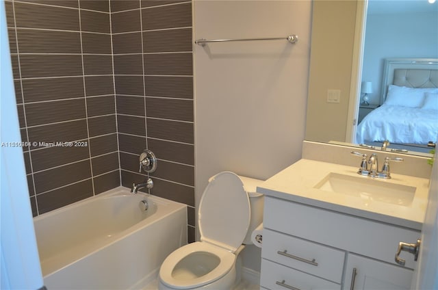 full bathroom featuring tiled shower / bath combo, vanity, and toilet