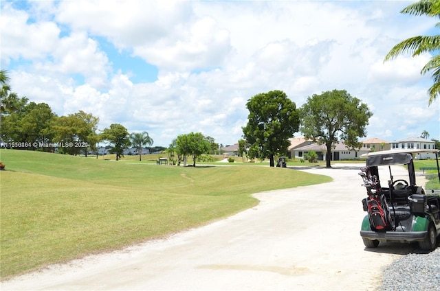 view of home's community featuring a lawn