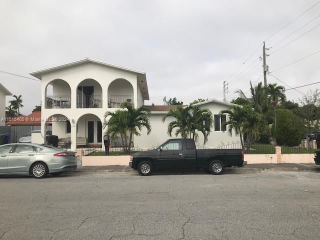 view of front of house featuring a balcony