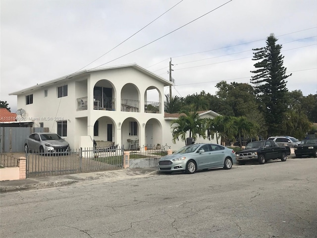 view of front of home with a balcony