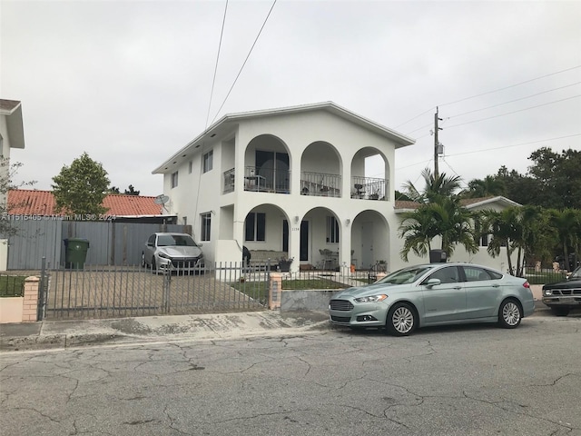 mediterranean / spanish-style home with a balcony