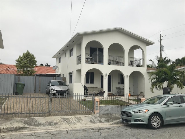 mediterranean / spanish-style house featuring a balcony