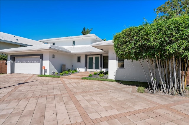 view of front of property with a garage