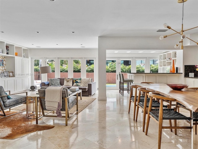 dining space featuring a wealth of natural light, french doors, and light tile patterned floors