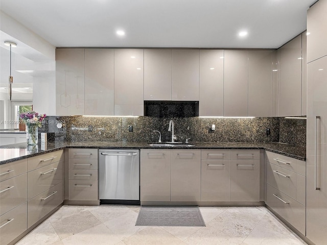 kitchen with dark stone countertops, stainless steel dishwasher, gray cabinets, and light tile patterned floors