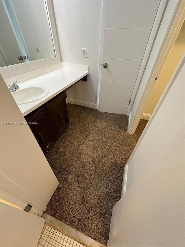 bathroom with tile flooring and oversized vanity