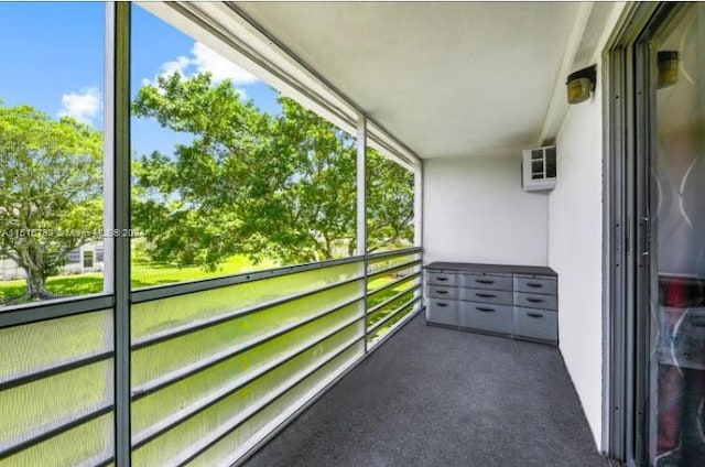 balcony featuring a wall mounted air conditioner