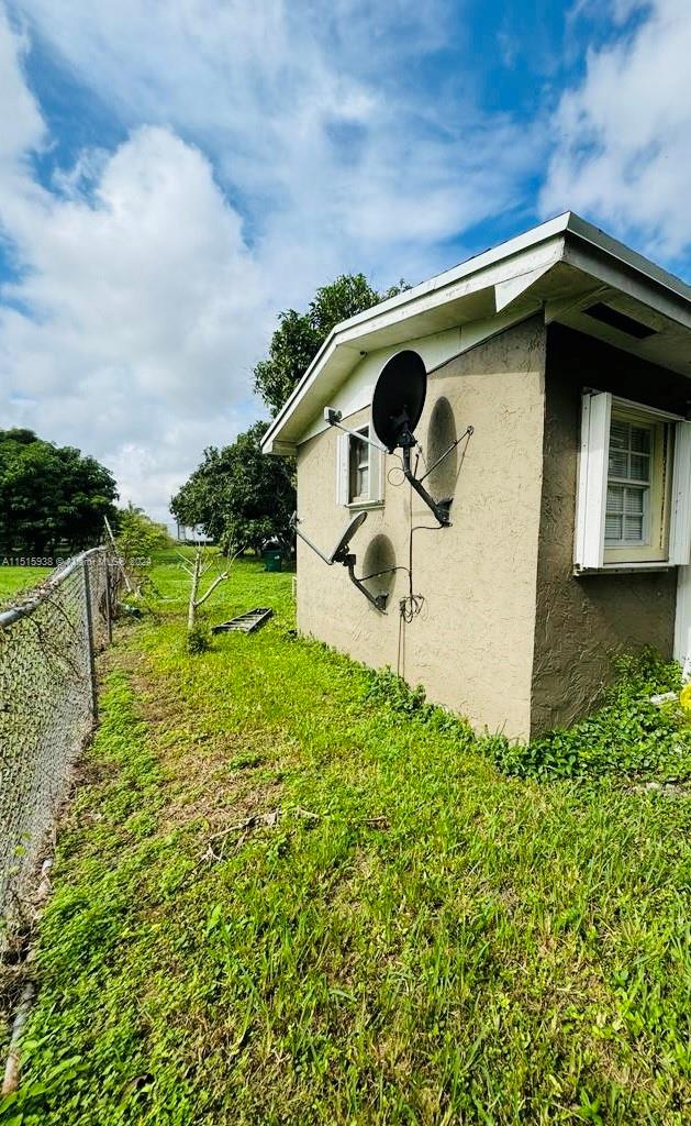 view of home's exterior featuring a yard