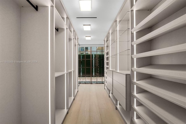 spacious closet featuring light hardwood / wood-style flooring