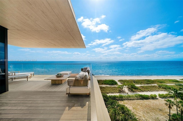 exterior space with a water view and a beach view