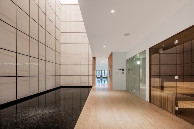 hallway with wood-type flooring