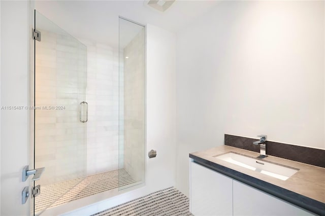 bathroom with vanity and walk in shower