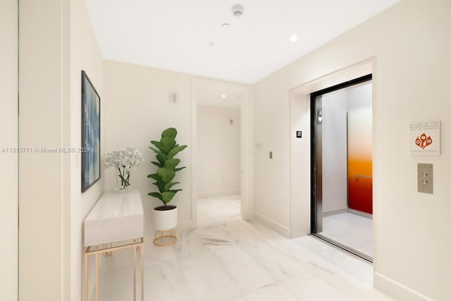 corridor featuring light tile flooring