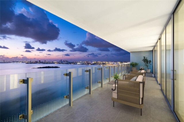 balcony at dusk with a water view