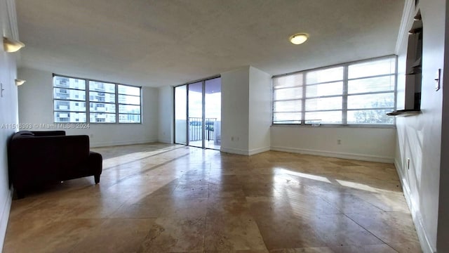 interior space with light tile flooring and a wealth of natural light