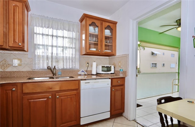 kitchen with white appliances, sink, decorative backsplash, ceiling fan, and light tile patterned floors