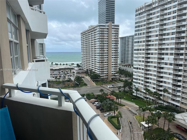 balcony featuring a water view