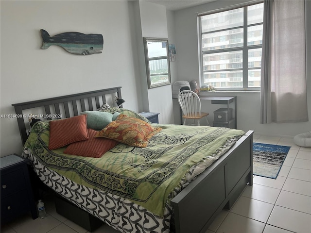 bedroom with light tile floors