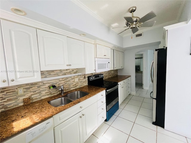 kitchen with ceiling fan, white cabinetry, appliances with stainless steel finishes, backsplash, and sink