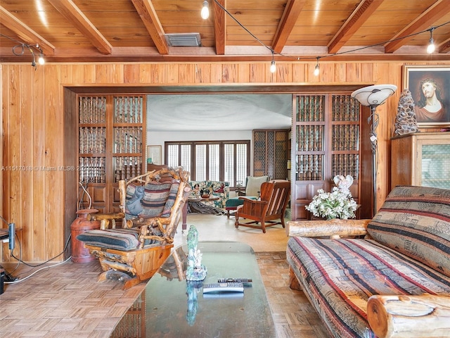 living room with beam ceiling, wooden ceiling, and parquet floors