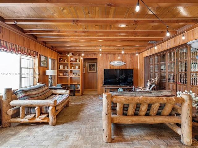 living room with parquet floors, wooden ceiling, and wooden walls