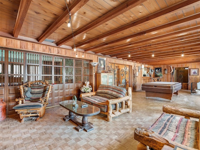 living room with wood ceiling, light parquet floors, wooden walls, and beam ceiling