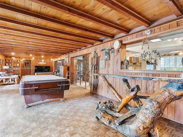 rec room with wood walls, beamed ceiling, parquet flooring, and wooden ceiling