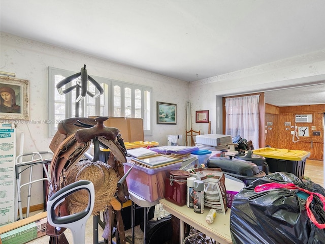 miscellaneous room featuring an AC wall unit and wood walls