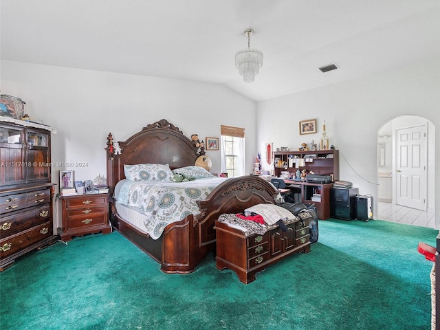 carpeted bedroom with lofted ceiling and an inviting chandelier