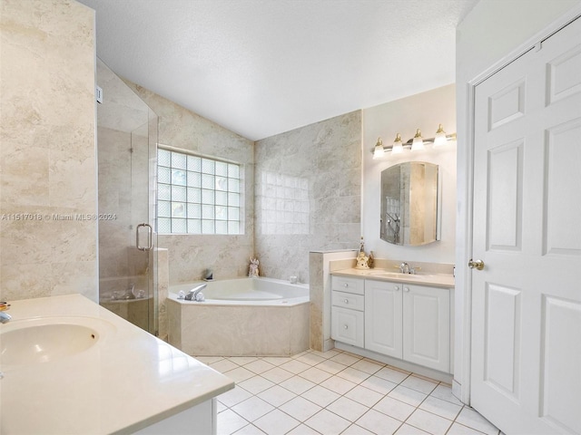 bathroom with vaulted ceiling, tile walls, a textured ceiling, tile patterned floors, and separate shower and tub