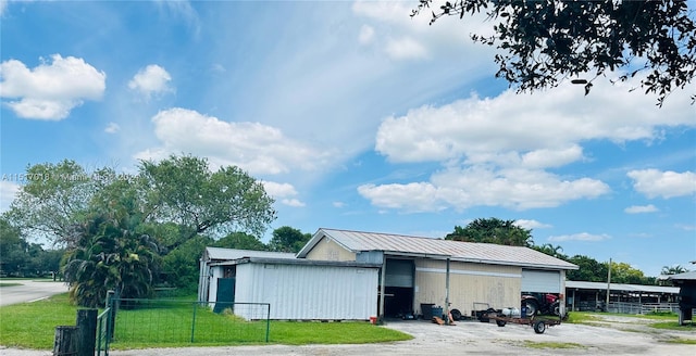 view of outbuilding with a garage and a lawn