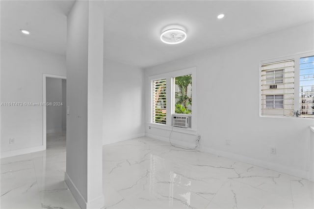 unfurnished room with light tile floors