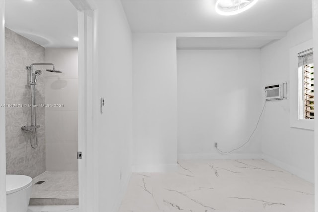 bathroom with a wall unit AC, toilet, tile flooring, and tiled shower