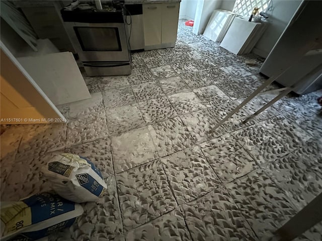 interior space featuring light tile floors