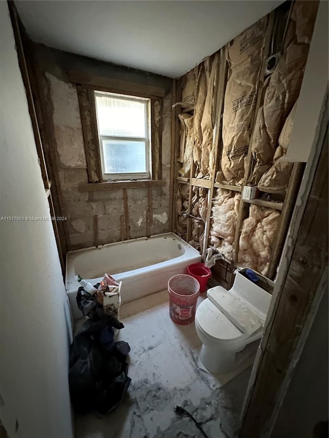 bathroom featuring shower / bathing tub combination and toilet