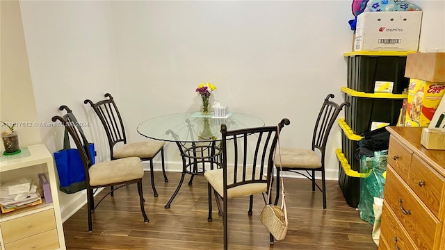 dining space featuring dark hardwood / wood-style flooring