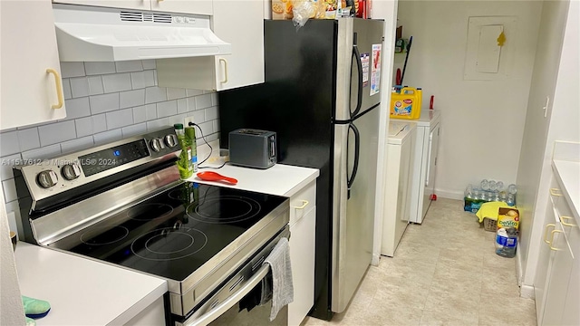 kitchen featuring premium range hood, light tile floors, washer and clothes dryer, stainless steel electric stove, and tasteful backsplash