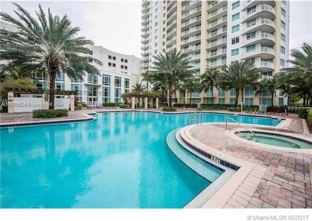 view of pool featuring a community hot tub